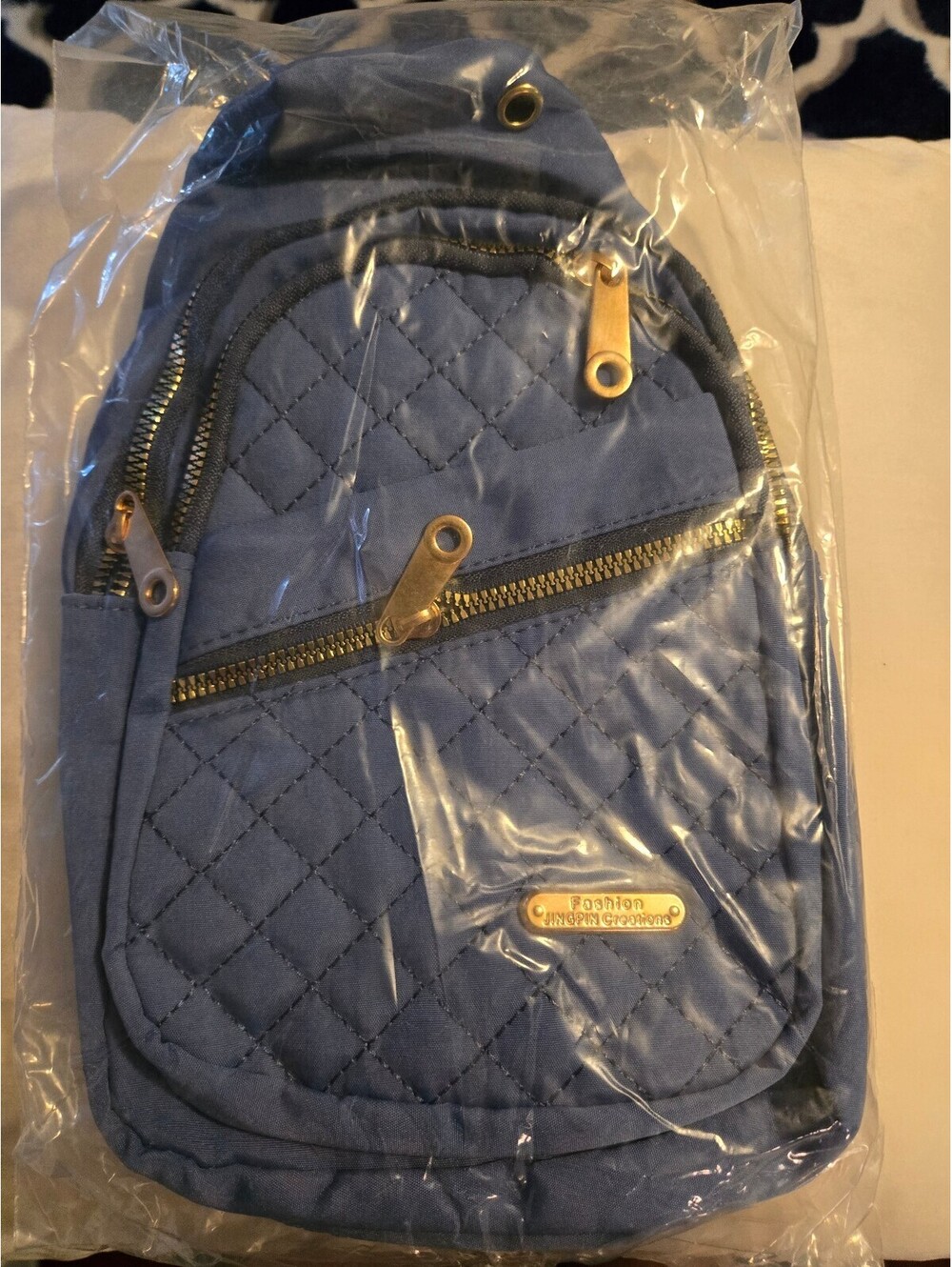 Quilted Blue Crossbody Bag with Adjustable Strap and Multiple Pockets